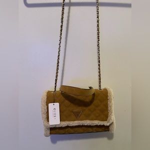 NWT: A Guess handbag/crossbody. Color is honey mustard